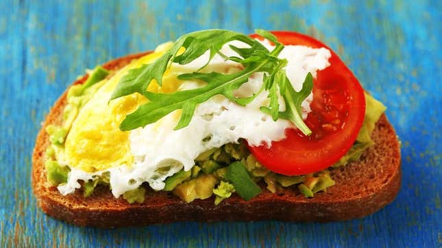 Avocado toast with egg and tomato