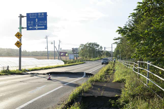 A damaged road is seen after a strong earthquake hit Hokkaido, in Abira.