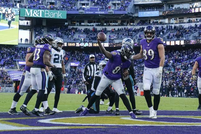 Nov 20, 2022; Baltimore, Maryland, USA;  Baltimore Ravens quarterback Lamar Jackson (8) spikes the ball after running for a touchdown against the Carolina Panthers during the second half at M&amp;amp;T Bank Stadium.