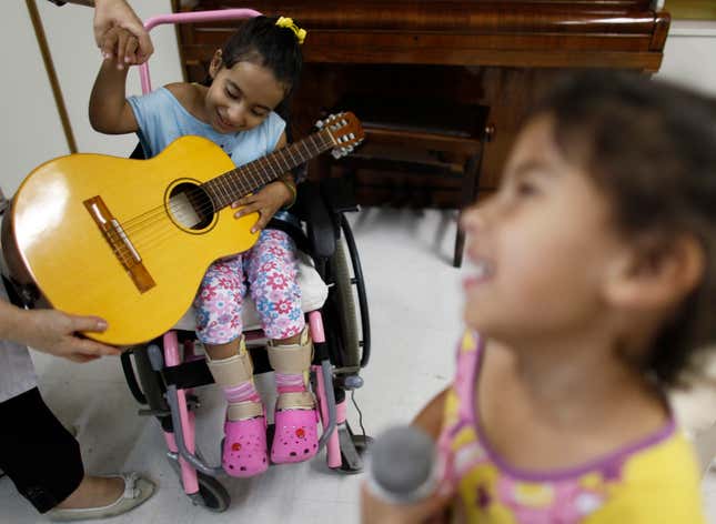 Children with disabling conditions and diseases take part in music therapy class in Sao Paulo, Brazil.