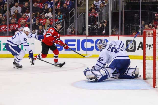 Mar 7, 2023; Newark, New Jersey, USA; Toronto Maple Leafs goaltender Ilya Samsonov (35) makes a save on New Jersey Devils center Jack Hughes (86) during the second period at Prudential Center.