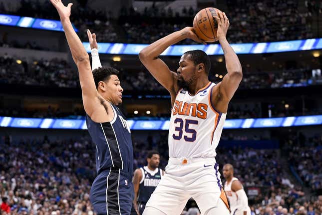 Mar 5, 2023; Dallas, Texas, USA; Phoenix Suns forward Kevin Durant (35) looks to pass the ball around Dallas Mavericks guard Josh Green (8) during the first quarter at the American Airlines Center.