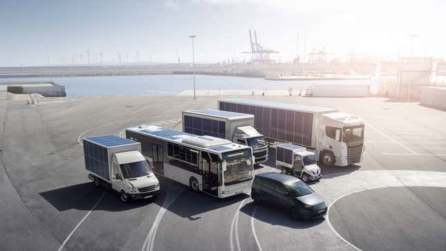 A photo showing a group of different sized trucks all covered in solar panels. 