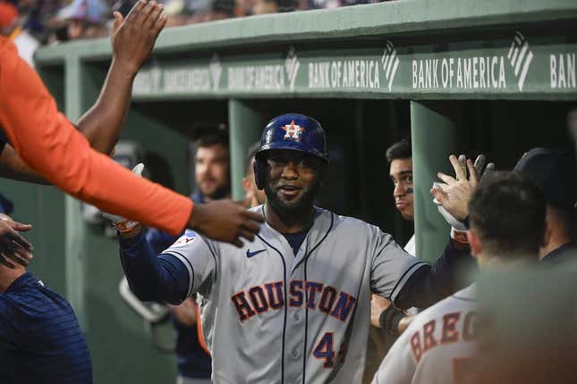 Aug 29, 2023; Boston, Massachusetts, USA;  Houston Astros designated hitter Yordan Alvarez (44) is congratulated in the dugout after hitting a home run during the first inning against the Boston Red Sox at Fenway Park.