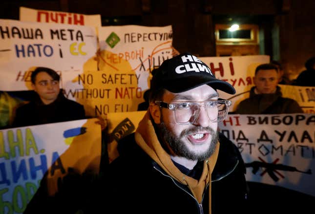 A demonstrator shouts during a rally ahead of the so-called “Normandy” format summit in Paris, where leaders of Ukraine, Russia, Germany and France will meet to discuss steps to resolve the conflict in eastern Ukraine, in Kiev, Ukraine December 8, 2019. REUTERS/Valentyn Ogirenko – RC26RD98JRCU