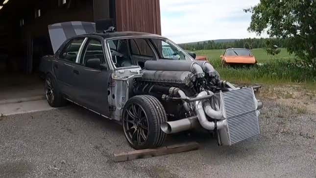 Image for article titled Hear A Glorious 27-Liter Twin-Turbo V12 Tank Engine Start Up In A Ford Crown Victoria