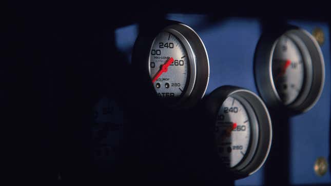 Three gauges on a car dashboard 