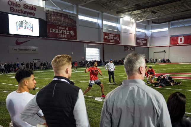 Ohio State Buckeyes quarterback C.J. Stroud throws in front of NFL scouts, including a contingent of Carolina Panthers including head coach Frank Reich, right, and quarterbacks coach Josh McCown, middle, during Ohio State football   s pro day at the Woody Hayes Athletic Center in Columbus on March 22, 2023.

Football Ceb Osufb Pro Day