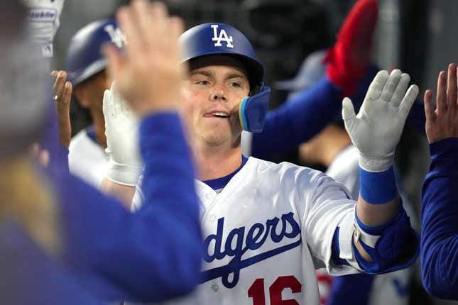 Apr 4, 2023; Los Angeles, California, USA; Los Angeles Dodgers catcher Will Smith (16) celebrates with teammates after hitting a two-run home run in the first inning against the Colorado Rockies at Dodger Stadium.