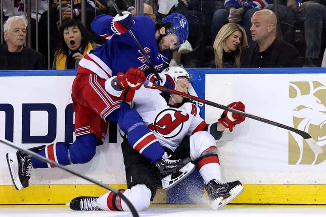 Apr 24, 2023; New York, New York, USA; New York Rangers defenseman Jacob Trouba (8) hits New Jersey Devils left wing Ondrej Palat (18) during the second period in game four of the first round of the 2023 Stanley Cup Playoffs at Madison Square Garden.