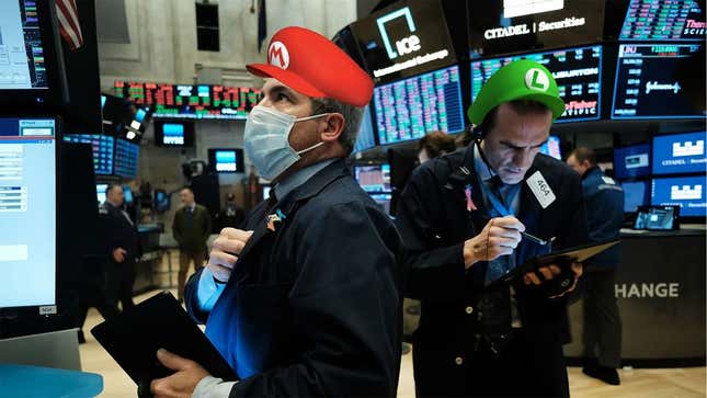 Two traders on the floor of the stock exchange wear Mario and Luigi hats. 