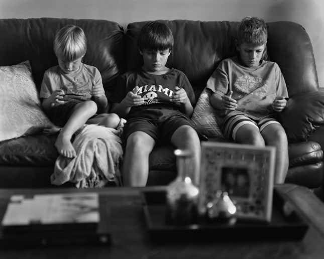 Image for article titled Photographer removes our smartphones to show our strange and lonely new world