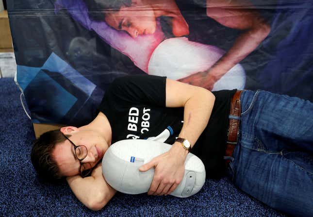 Julian Martijn Jagtenberg poses with a Somnox Sleep Robot, which mirrors your breathing for a better night's sleep, at "CES Unveiled" during the 2019 CES in Las Vegas