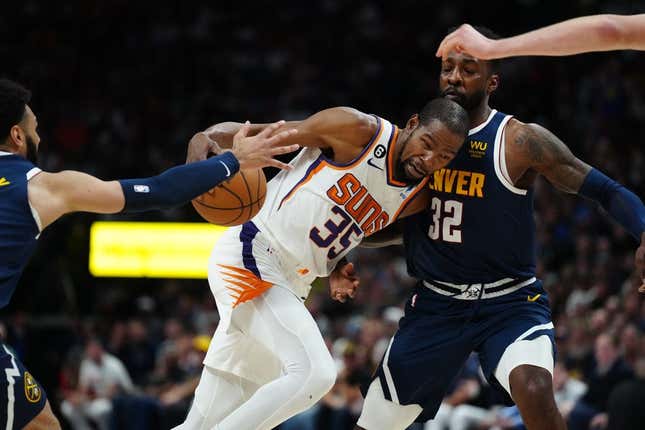 May 1, 2023; Denver, Colorado, USA; Phoenix Suns forward Kevin Durant (35) drives at Denver Nuggets forward Jeff Green (32) in the first half during game two of the 2023 NBA playoffs at Ball Arena.