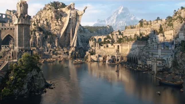 An elaborate city of stone parapents and massive statues sits at the edge of a large bay of water.