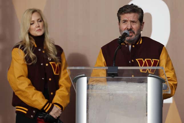 Feb 2, 2022; Landover, MD, USA; Washington Commanders co-owner Dan Snyder speaks as co-owner Tanya Snyder (L) listens during a press conference revealing the Commanders as the new name for the formerly named Washington Football Team at FedEx Field.