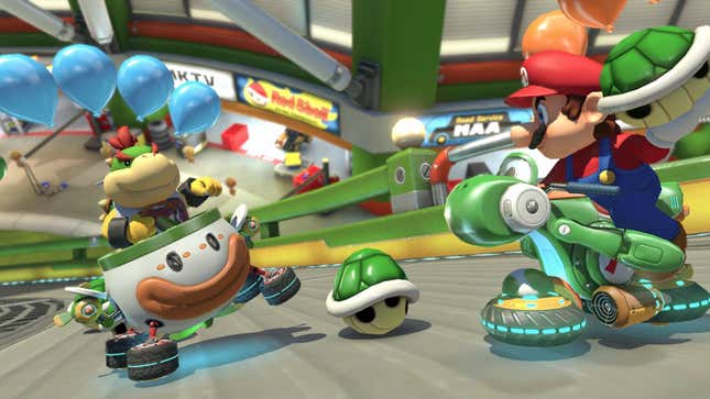 A screenshot from Mario Kart 8 Deluxe, depicting Mario preparing to throw a green shell at Bowser Jr.