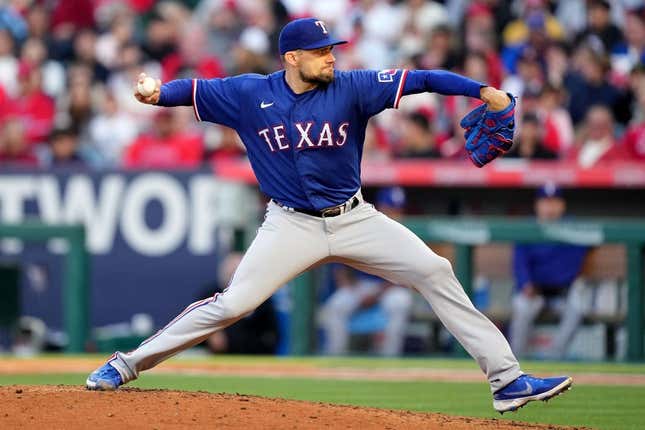 May 6, 2023; Anaheim, California, USA; Texas Rangers relief pitcher Dane Dunning (33) throws against the Los Angeles Angels in the third inning at Angel Stadium.