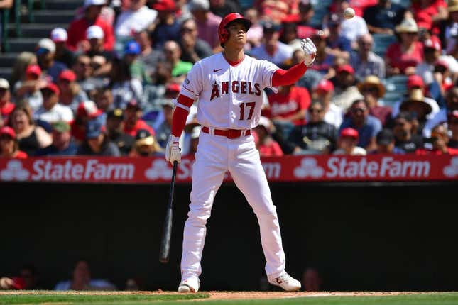 May 10, 2023; Anaheim, California, USA; Los Angeles Angels designated hitter Shohei Ohtani (17) tosses the ball back to the dugout during an at bat against the Houston Astros during the sixth inning at Angel Stadium.