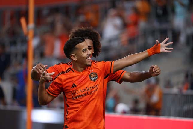 Aug 20, 2023; Houston, Texas, USA; Houston Dynamo midfielder Amine Bassi (8) celebrates after scoring a goal with teammate during the first half at Shell Energy Stadium.