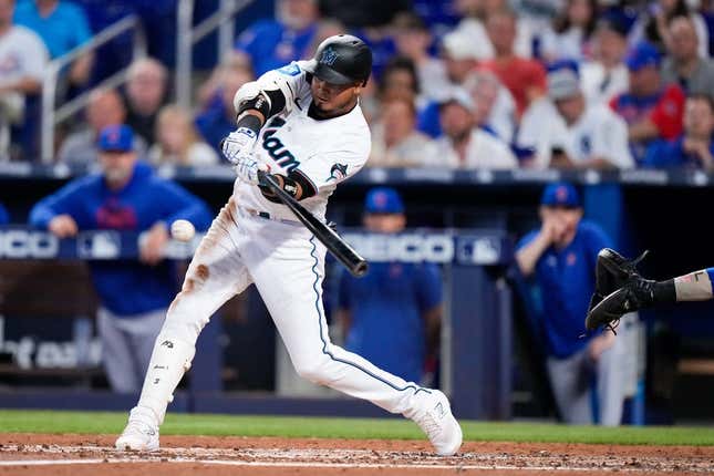 Apr 30, 2023; Miami, Florida, USA; Miami Marlins second baseman Luis Arraez (3) hits a single against the Chicago Cubs during the fourth inning at loanDepot Park.