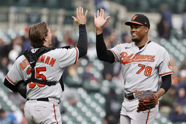 Apr 30, 2023; Detroit, Michigan, USA; Baltimore Orioles catcher Adley Rutschman (35) and relief pitcher Yennier Cano (78) celebrate after defeating the Detroit Tigers at Comerica Park.