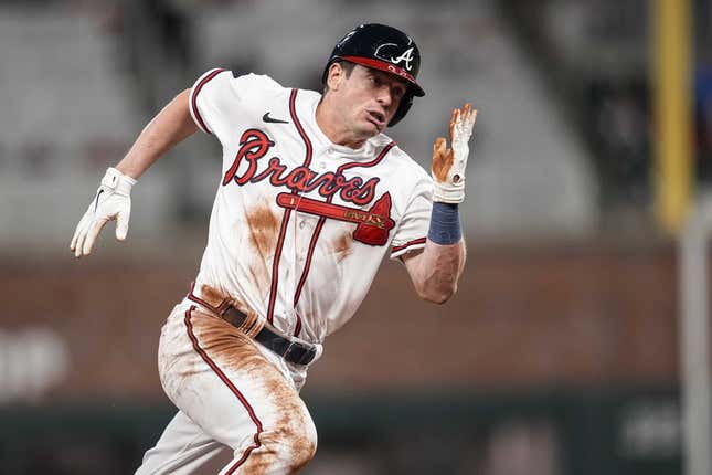 Apr 26, 2023; Cumberland, Georgia, USA;  Atlanta Braves pinch runner Nick Solak (15) scores a run against the Miami Marlins during the eighth inning at Truist Park.