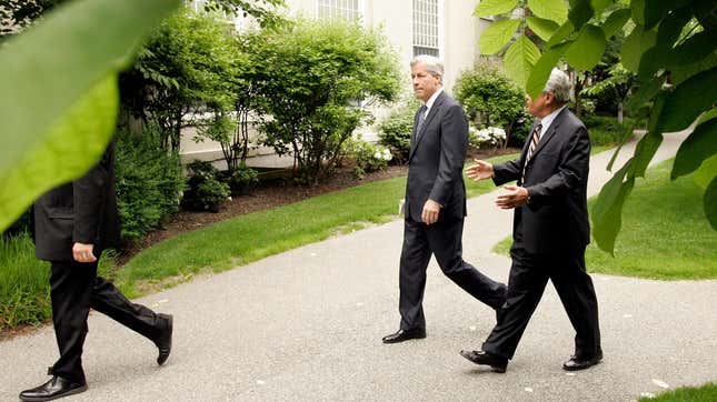 Jamie Dimon is accompanied on a walk at Harvard Business School's campus in 2009