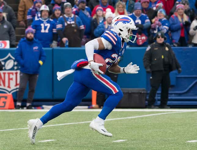 Jan 8, 2023; Orchard Park, New York, USA; Buffalo Bills running back Nyheim Hines (20) returns a kickoff to score a touchdown on the opening play of a game against the New England Patriots at Highmark Stadium.