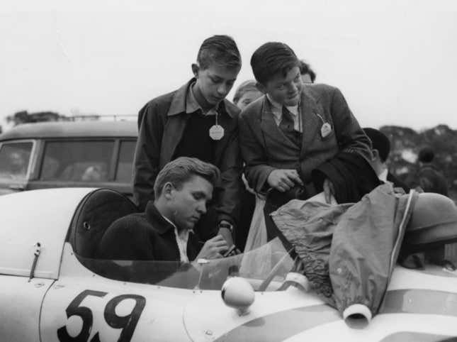 Lance Reventlow signs autographs before a Formula 2 race at Crystal Palace.