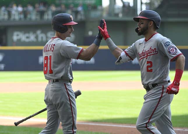 Sep 17, 2023; Milwaukee, Wisconsin, USA;Washington Nationals catcher Drew Millas (81), left congratulates Washington Nationals second baseman Luis Garcia (2) after hitting a home run against the Milwaukee Brewers in the first inning at American Family Field.