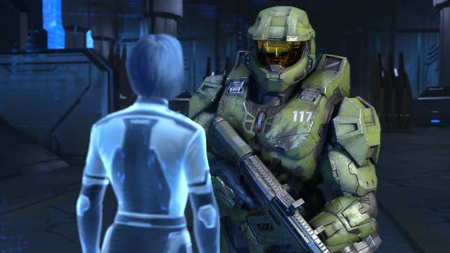 Master Chief looks at the weapon in Halo Infinite's campaign.
