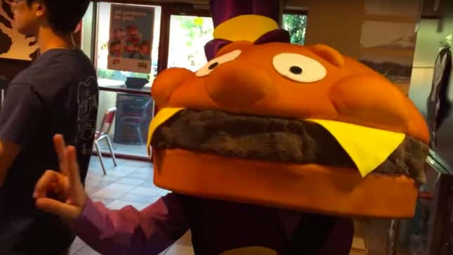 Person dressed as Mayor McCheese in McDonald's line