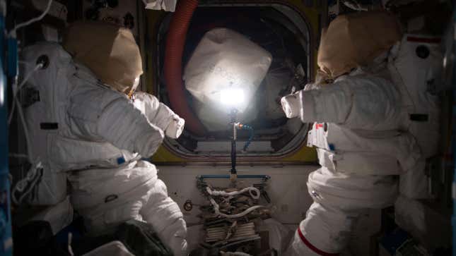 A pair of spacesuits inside the Quest airlock on board the ISS.