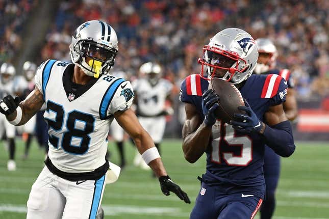 Aug 19, 2022; Foxborough, Massachusetts, USA; New England Patriots wide receiver Nelson Agholor (15) makes a catch with pressure from Carolina Panthers cornerback Keith Taylor Jr. (28) during the first half of a preseason game at Gillette Stadium.