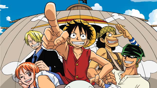 Monkey D. Luffy sits on the sheep's-head mast of his ship with crew behind him.