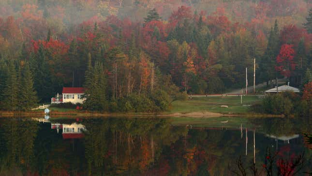 A photo of a house by a lake in Vermont 