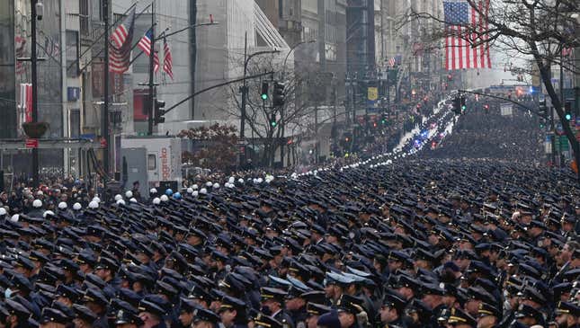 Image for article titled Thousands Of Police Officers March Through Streets To Mourn Cop Who Was Shot While Scratching Ear With Gun