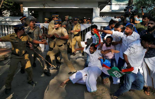 An officer removing members of Kerala Students Union, the student wing of India’s main opposition party, the Indian National Congress, from outside a police station in Kochi on Jan. 03.