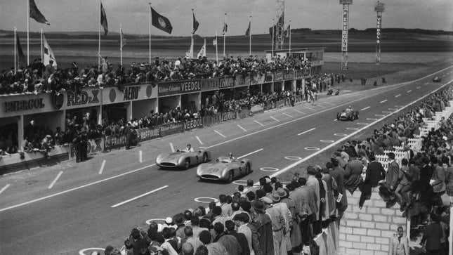 A black and white photo of the two Mercedes cars leading the 1954 French Grand prix.