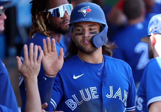 Mar 12, 2023; Clearwater, Florida, USA; Toronto Blue Jays shortstop Bo Bichette (11) scores a run against the Philadelphia Phillies during the fourth inning at BayCare Ballpark.