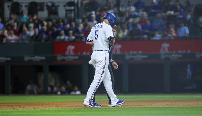 Apr 11, 2023; Arlington, Texas, USA;  Texas Rangers shortstop Corey Seager (5) leaves the game with an injury during the fifth inning against the Kansas City Royals at Globe Life Field.