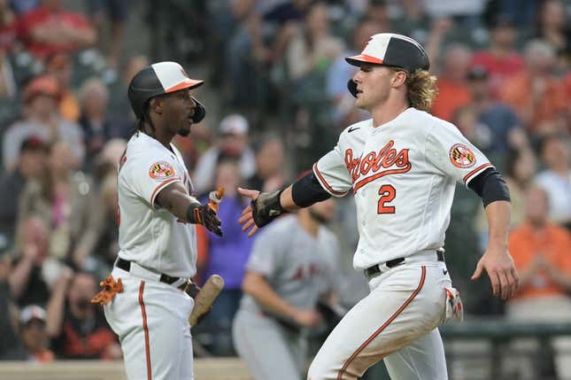 May 16, 2023; Baltimore, Maryland, USA; Baltimore Orioles third baseman Gunnar Henderson (2) celebrates with Baltimore Orioles shortstop Jorge Mateo (3) after scoring during the fourth inning against the Los Angeles Angels  at Oriole Park at Camden Yards.