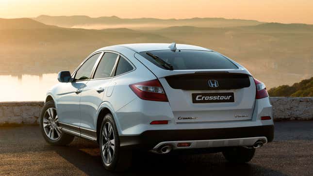 A photo of a white Honda Crosstour at sunset. 