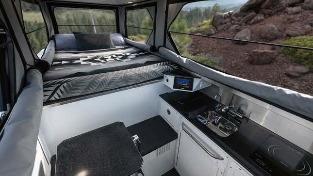An image showing the interior of the GMC Hummer EV camper. 