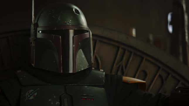 Boba Fett donning his infamous armor in The Book of Boba Fett. His helmet has a dent in it.