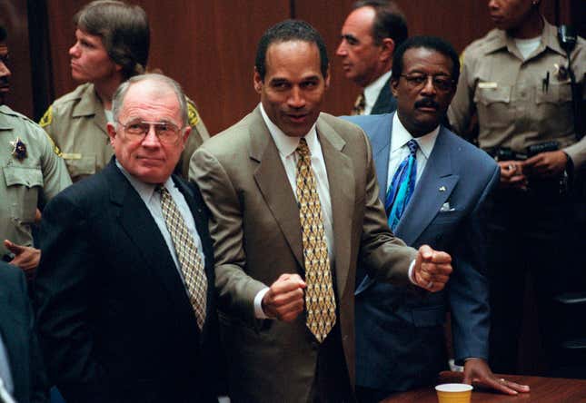 O.J. Simpson, center, with defense attorneys F. Lee Bailey, left, and Johnnie Cochran after Simpson was found not guilty of murdering his ex-wife Nicole Brown Simpson and her friend Ron Goldman at the Criminal Courts Building in Los Angeles on Oct. 3, 1995. 