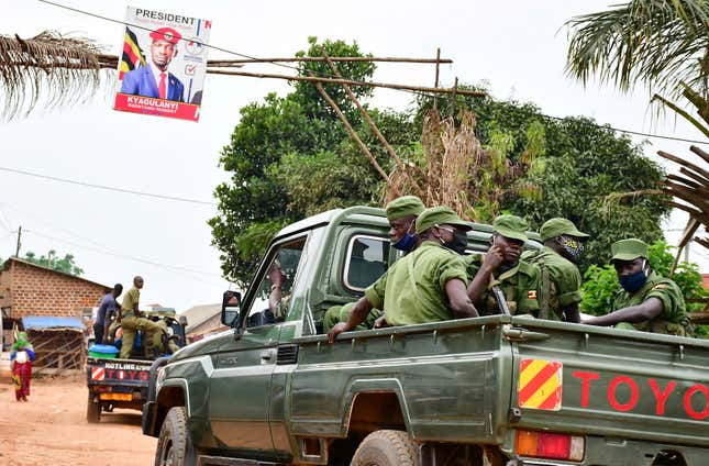 Ugandan security officers patrol an area near the home of presidential candidate and singer Robert Kyagulanyi, known as Bobi Wine in the Magere neighborhood of Kampala, Uganda Jan. 16, 2021.