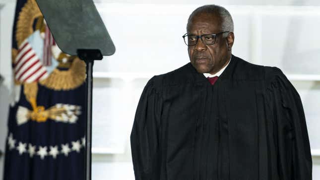 Clarence Thomas, associate justice of the U.S. Supreme Court, listens during a ceremony on the South Lawn of the White House in Washington, D.C., U.S., on Monday, Oct. 26, 2020. 