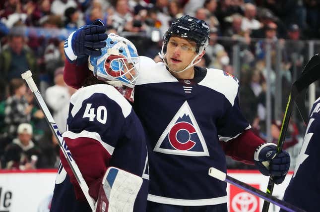 Mar 24, 2023; Denver, Colorado, USA; Colorado Avalanche goaltender Alexandar Georgiev (40) and defenseman Erik Johnson (6) celebrate defeating the Arizona Coyotes at Ball Arena.